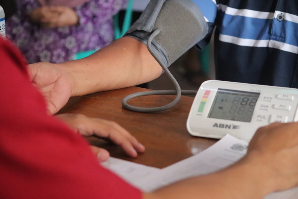 Doctor checking the Blood Pressure of a patient
