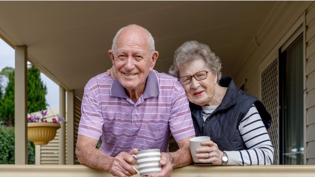 two elder people having coffee together